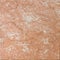 Salmon red textured marble