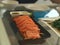 Salmon sashimi in black plate on table, Japanese food