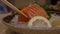 Salmon sashimi slice with chopsticks.Japanese cuisine