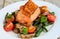 Salmon served with mushrooms asparagus cherry tomatoes