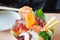 Salmon slice in chopsticks, Eating Sashimi Rice Bowl