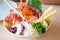 Salmon slice in chopsticks, Eating Sashimi Rice Bowl Chirashi Don