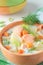 Salmon soup with cream, potatoes and carrots