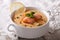 Salmon soup with lemon closeup on the table. horizontal