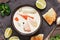 Salmon soup with potatoes, carrots, cream. Scandinavian ,Norwegian fish soup on a rustic wooden background. Close-up, top view