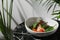 Salmon steak with spinach on whute plate and marble table closeup