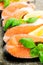 Salmon on stone with basil and lemon vertical