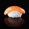 Salmon sushi on black mirroring background