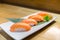 Salmon sushi, Japanese food delicious menu, served on wooden counter table