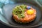 Salmon tartare with cucumber, onions, small leaves