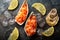 Salmon tartare raw chopped served in oyster shells top view on stone background