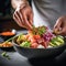 Salmon and tuna poke bowl. Close up of chef\\\'s hands cooking Poke bowl with tuna, salmon, avocado, edame beans and rice