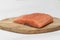 salmon on wooden board isolated, takeaway cooking process