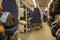 Salon of a railway car with passenger blue seats.