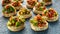 Salsa canape cracker appetizers with soft cheese