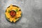 Salsa sauce and nachos on a plate, gray concrete stone background. Traditional latin american appetizer. Top view, flat lay