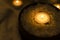 Salt bath concept.Dark and quiet atmosphere.Closeup of sea salt in the bowl and candles