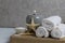 Salt for bath massage peeling spa relax massage. Home salon body care. Beauty. White towels starfish salt candles on a wooden tray
