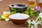 Salt bowl, essential oil, flower float on water china backgroun