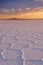 Salt flat Salar de Uyuni in Bolivia at sunrise