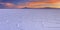 Salt flat Salar de Uyuni in Bolivia at sunrise