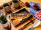 Salt-grilled Mackerel served in dish with black coffee side view of taiwan food