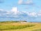 Salt marshes and dunes with sand couch and marram grass in nature reserve Boschplaat on Frisian island Terschelling, Netherlands