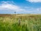 Salt marshes with no entry warning sign and beacon in nature reserve Het Oerd on West Frisian island Ameland, Friesland,