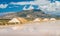 Salt pans in the sun with Erice mountain in the background. Trapani salt flats, Sicily, southern Italy.