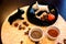 Salt and pepper shakers in the form of two bull terriers. Black and white ceramic molds on the kitchen table.