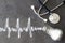 Salt shaker, stethoscope, cardiogram made of salt, hypertension concept