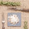 Salt with spices on dark plate with rosemary and antique forks