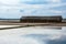 Salt storage granaries, sea salt storage in salt farms. Granary for salt storage and salt farm Solar. Abandoned old wood salt barn