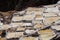 The salt terraces of Maras Cusco the snowcapped Salkantay Andes mountain peak in the background, Sacred Valley of the Inca,