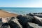 Saltdean beach seafront cliffs with boats in the background at East Sussex Brighton marina, UK