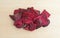 Salted beet chips on a wood cutting board
