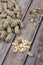 Salted healthy peanuts on a wooden surface