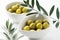 Salted olives placed on a white background