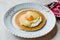 Salted Pancake with Hollandaise Suace, Eggs and Crispy Bacon for Breakfast. Salty Organic Fast Food