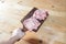 Salted and peppery steak lies on a wooden stand