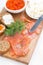 Salted salmon, red caviar, toast and butter, vertical, top view