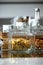 Salted and sweet cookies in transparent glass boxes on a kitchen table