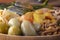 Salted tomatoes in a wooden plate on a background of fermented foods.