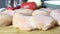Salting raw chicken breasts slow motion