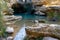 The Salto del Usero nature reserve with eroded sandstone cliffs and colorful pools of water