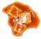 Salty Caramel candies with caramel sauce isolated on a white background close up