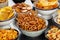 Salty snacks, party mix. An assortment of crispy appetizers in bowls