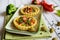 Salty tartlets with bacon, bell pepper, broccoli, cheese, onion, egg and olives