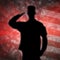 Saluting soldier\'s silhouette on an army camouflage background