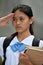 A Saluting Youthful Asian Female Student